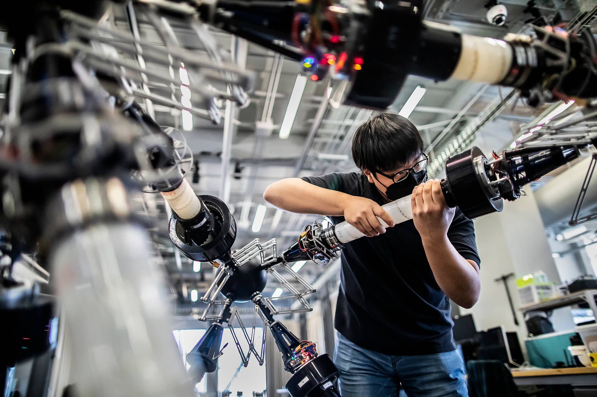 student adjusting a projects engineering.
